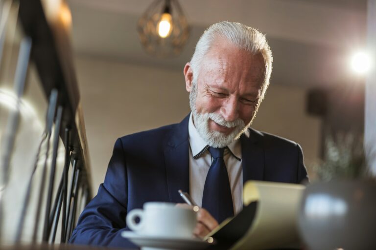 Senior businessman signing contract